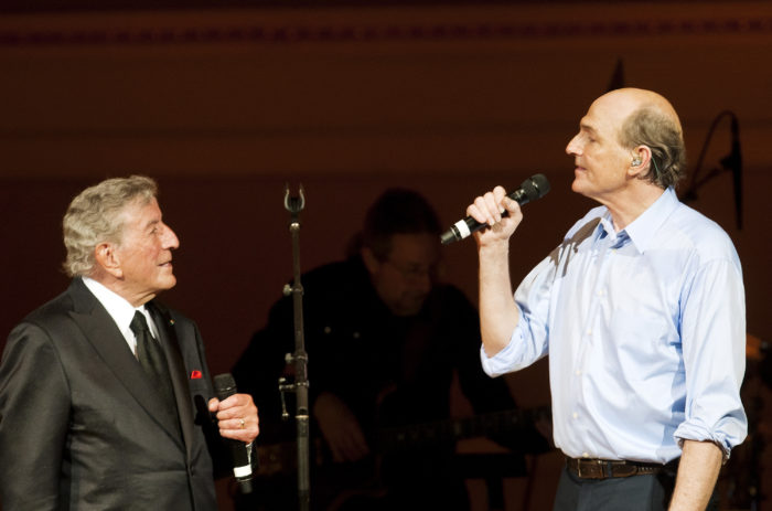 Famed Folk-Rock singer-songwriter JAMES TAYLOR performing with his surprise guest star legendary singer TONY BENNETT at his "James Taylor: Roots" concert in the Carnegie Hall "James Taylor's Perspectives" series  at Carnegie Hall, New York City, Wednesday, 20 April 2011. CREDIT: Photograph © 2011 Jack Vartoogian/FrontRowPhotos. ALL RIGHTS RESERVED.